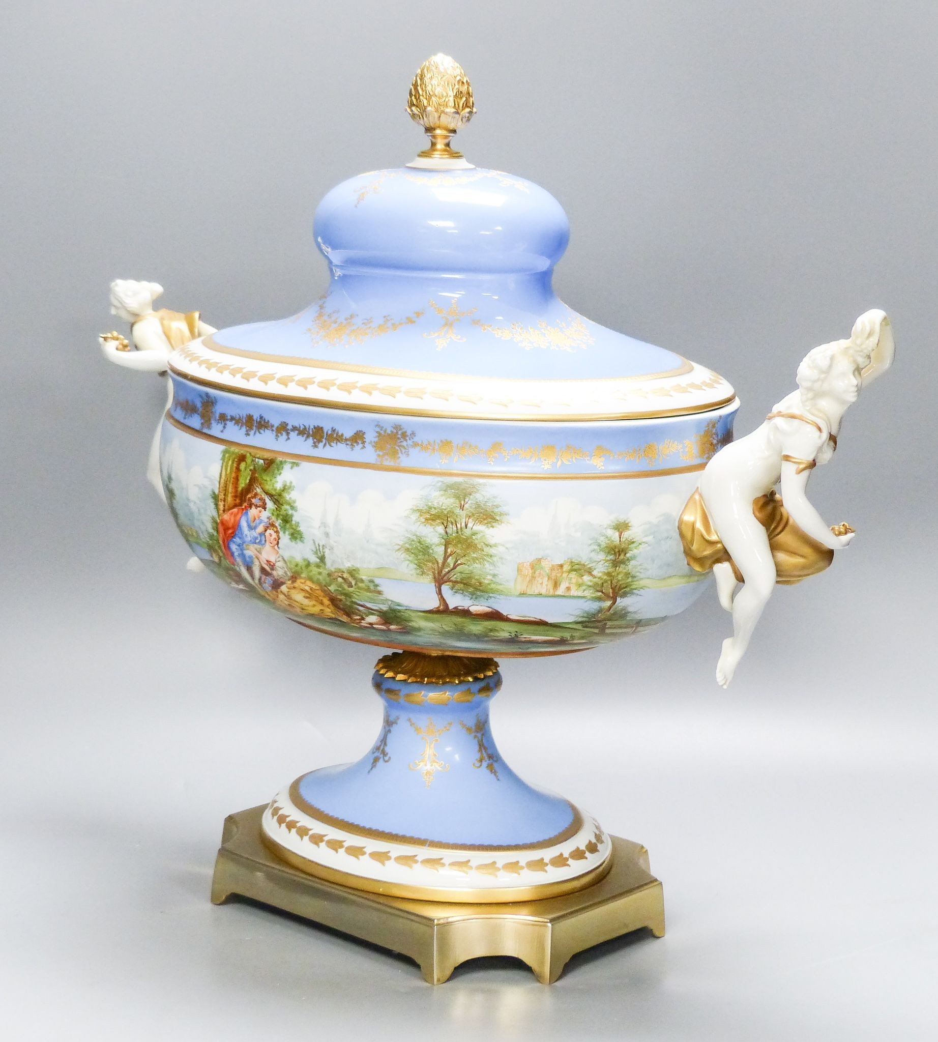 A large 20th century Sevres style porcelain and brass mounted pedestal vase and cover, 49 cm wide